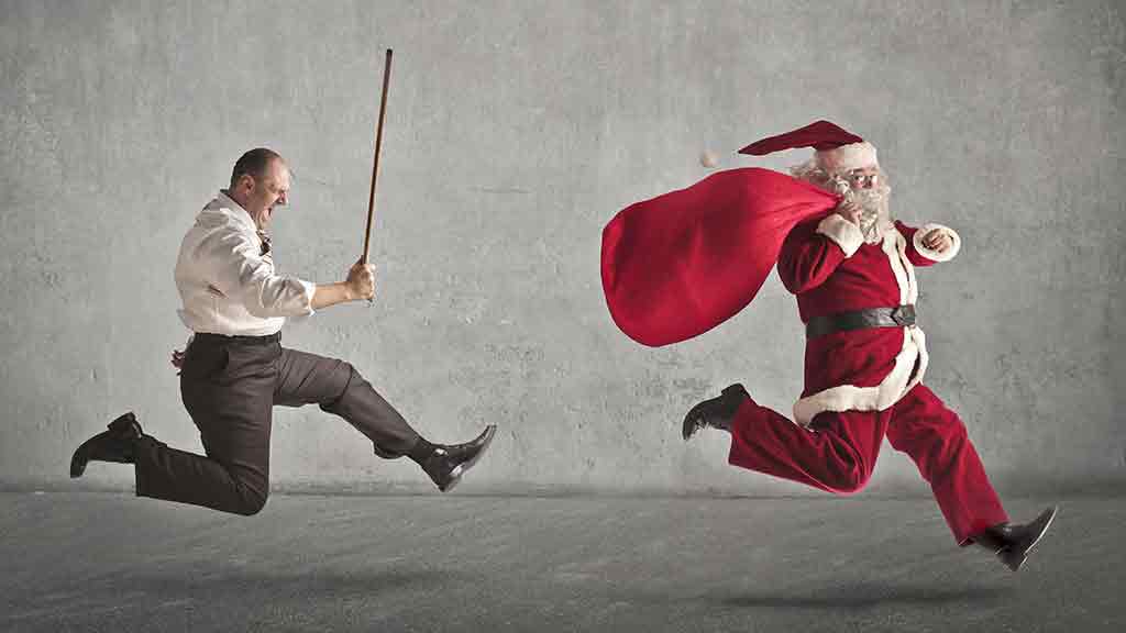 man with stick chasing santa claus