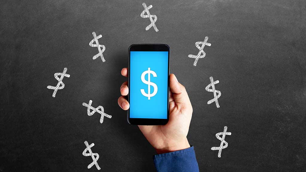 Smartphone surrounded by dollar symbols