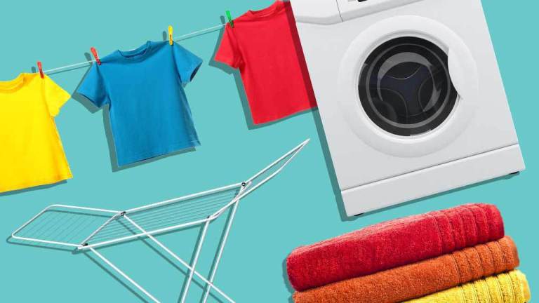 dryer with clothesline drying rack and stack of towels