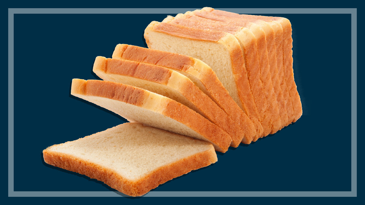 Sliced white bread on navy background