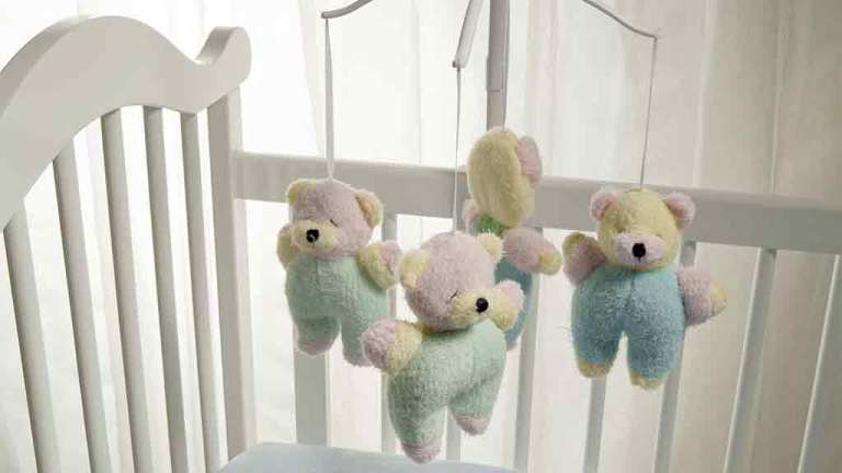 crib with teddy bear mobile
