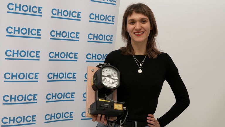 linda_from_choice_campaigns_holding_an_home_electricity_meter