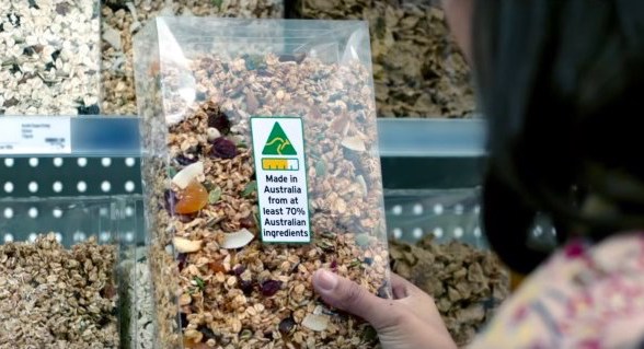 woman looking at country of origin labelling