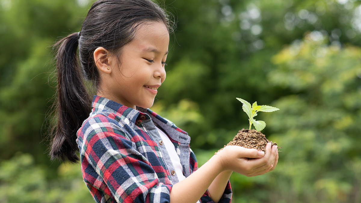 superannuation_young_girl_holding_a_plant