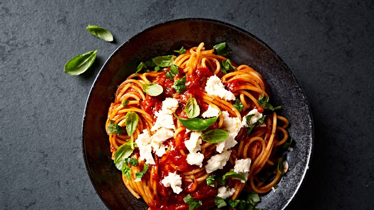 spaghetti pasta dish on dark plate