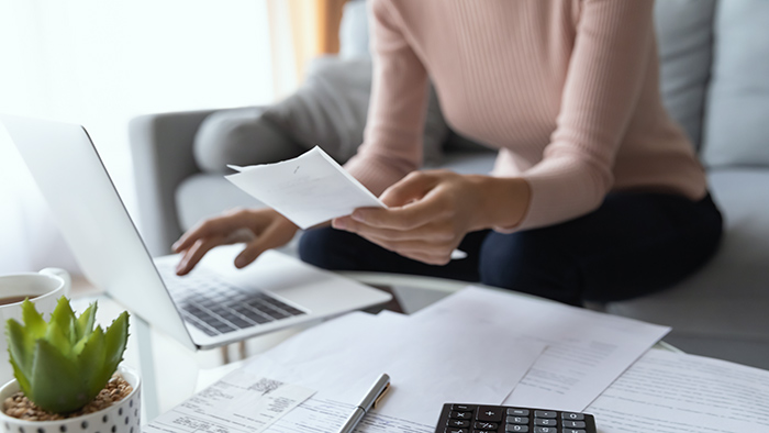 person checking bills and their finances