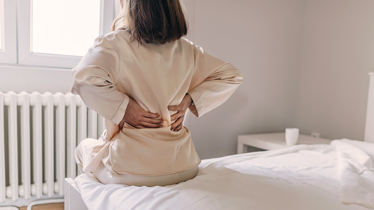 person with bad back after sleeping