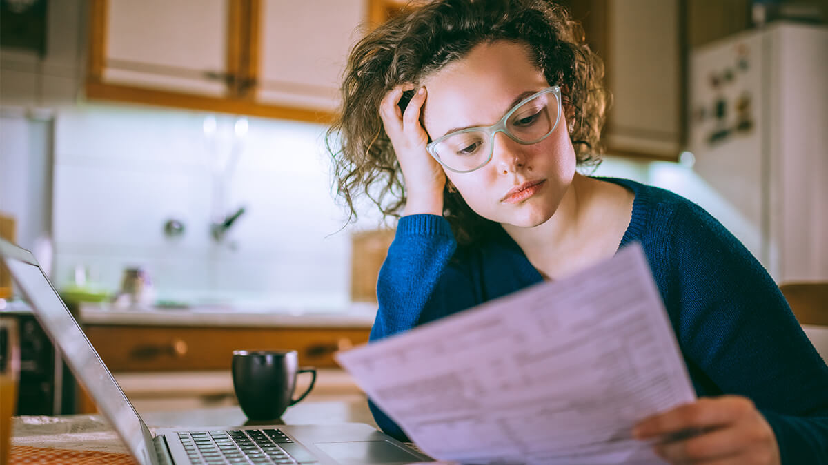 young woman looking at documents
