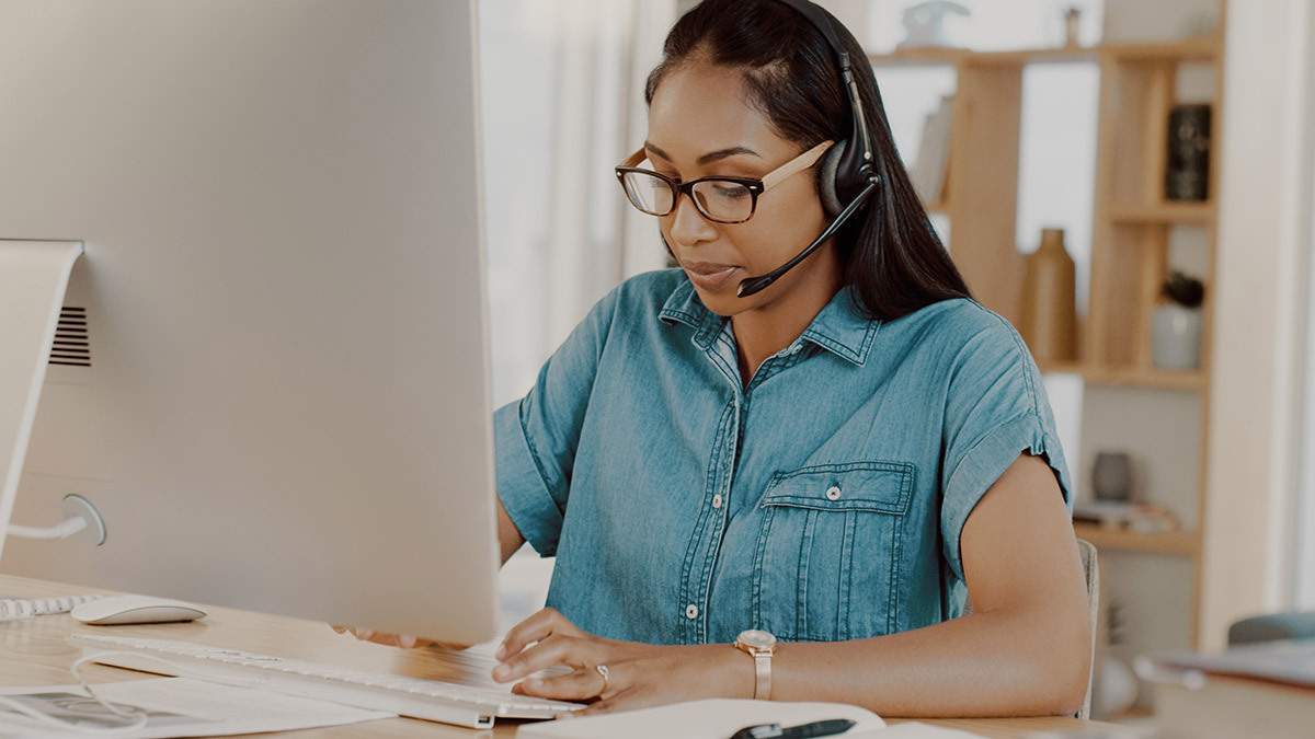 woman_working_from_home_wearing_bluetooth_headset