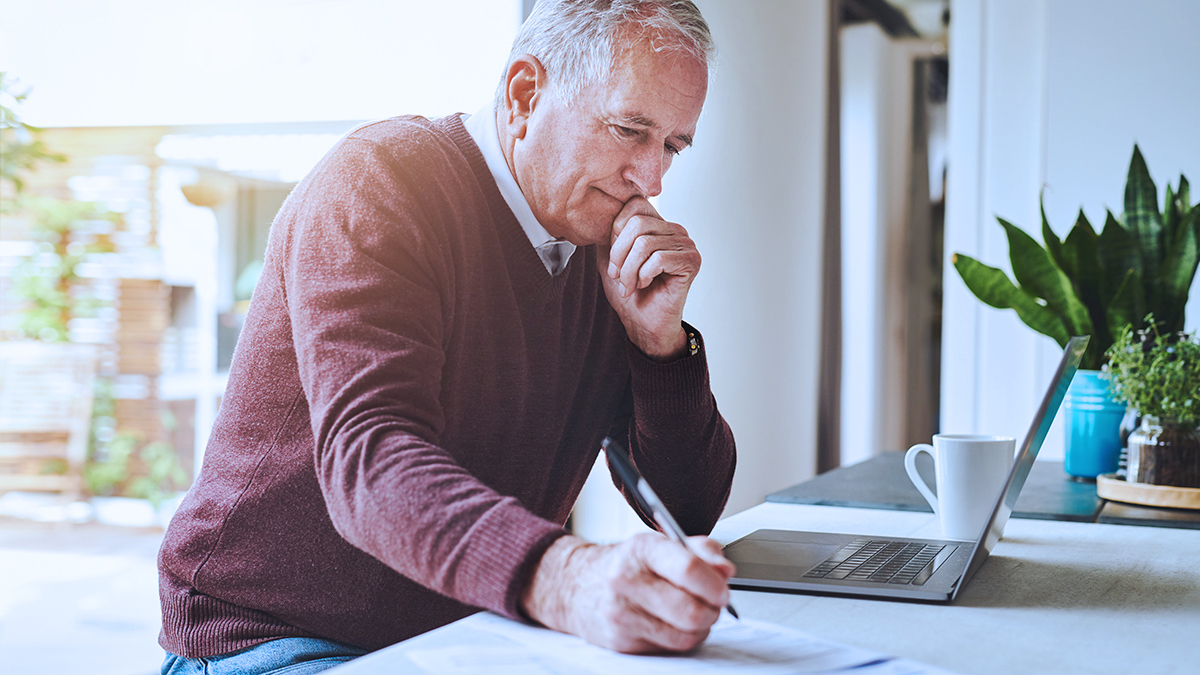 senior_person_filling_out_form