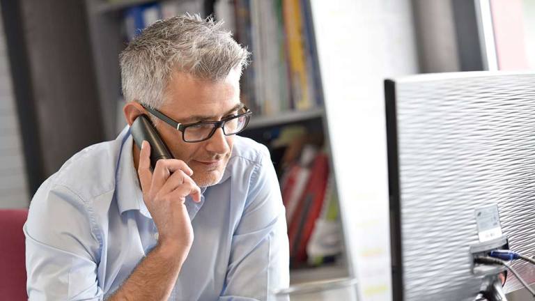 older man on phone choice help