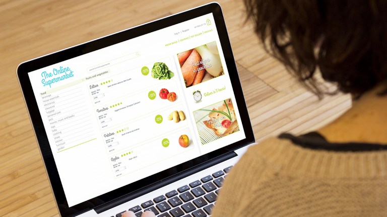 person shopping online for groceries on a laptop