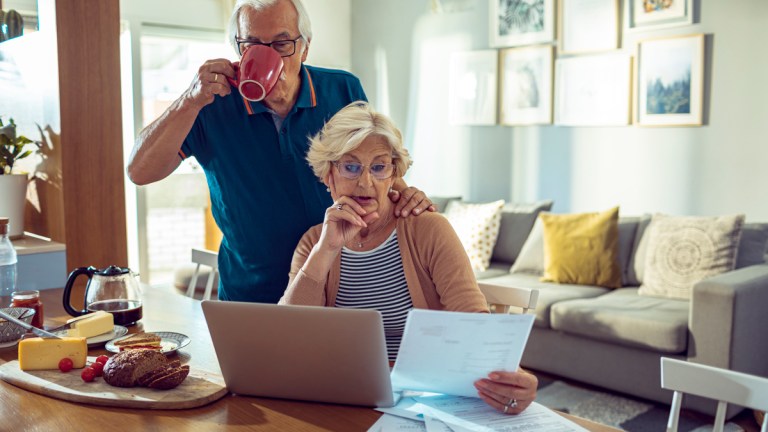 couple looking at super fund papers