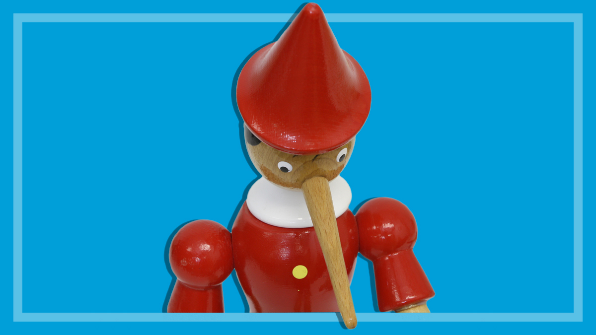 pinocchio_puppet_looking_down_at_article_below