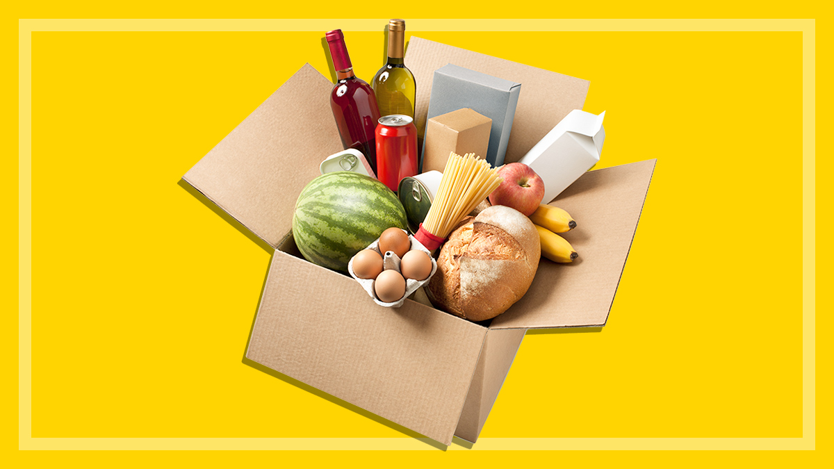 an open box of groceries on a yellow background
