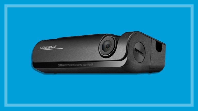 Thinkware T700 dash cam on a blue background