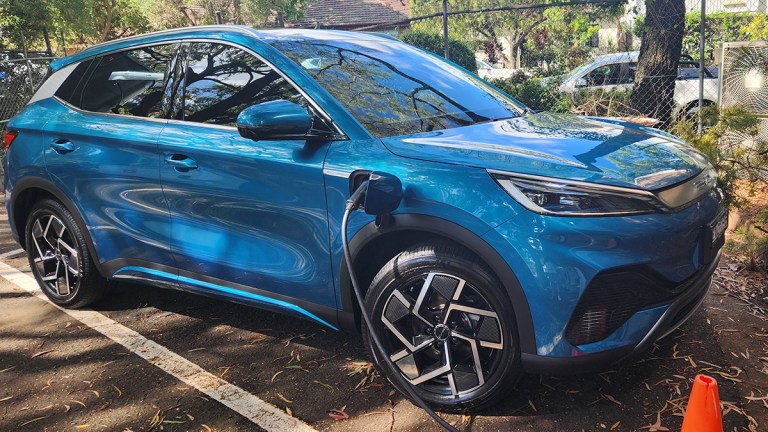 Blue BYD Atto 3 charging in choice car park