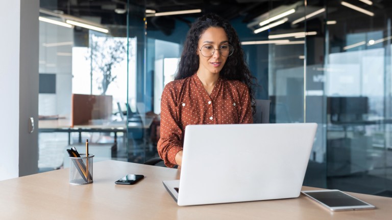 woman working on laptop ai regulation