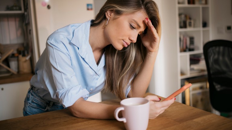 woman_looking_at_phone_scam