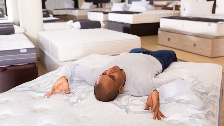 person_testing_a_mattress_instore