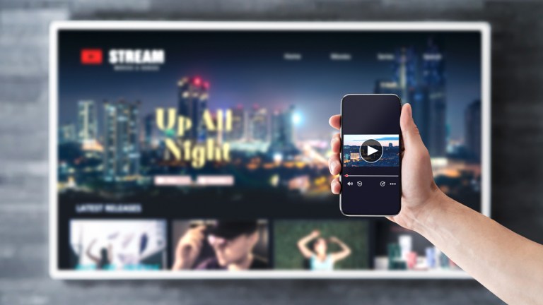 person streaming a movie from their phone to their tv