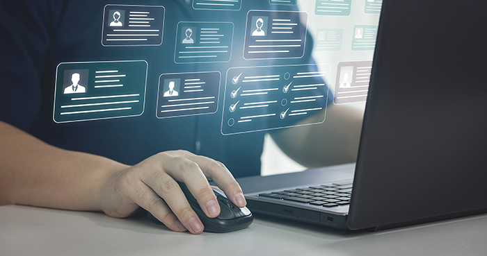 person_accessing_client_database_on_laptop