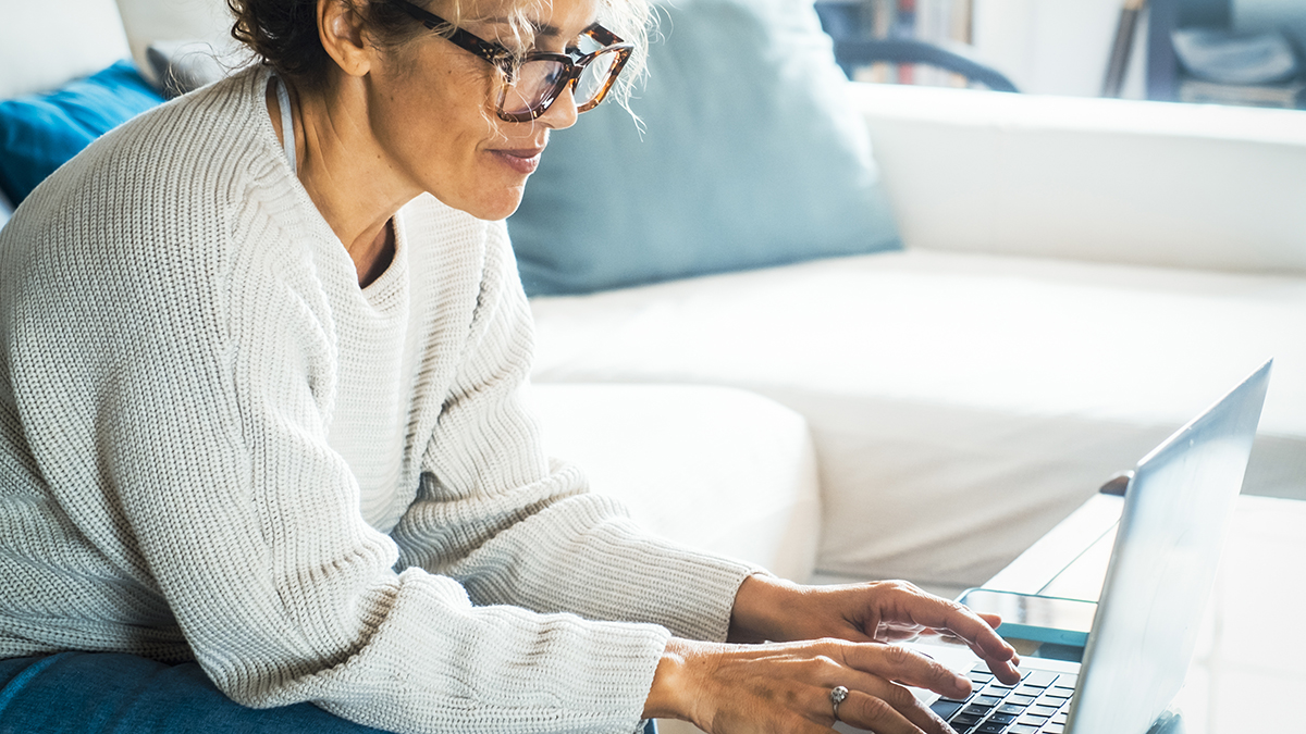 person using online home insurance calculator on laptop