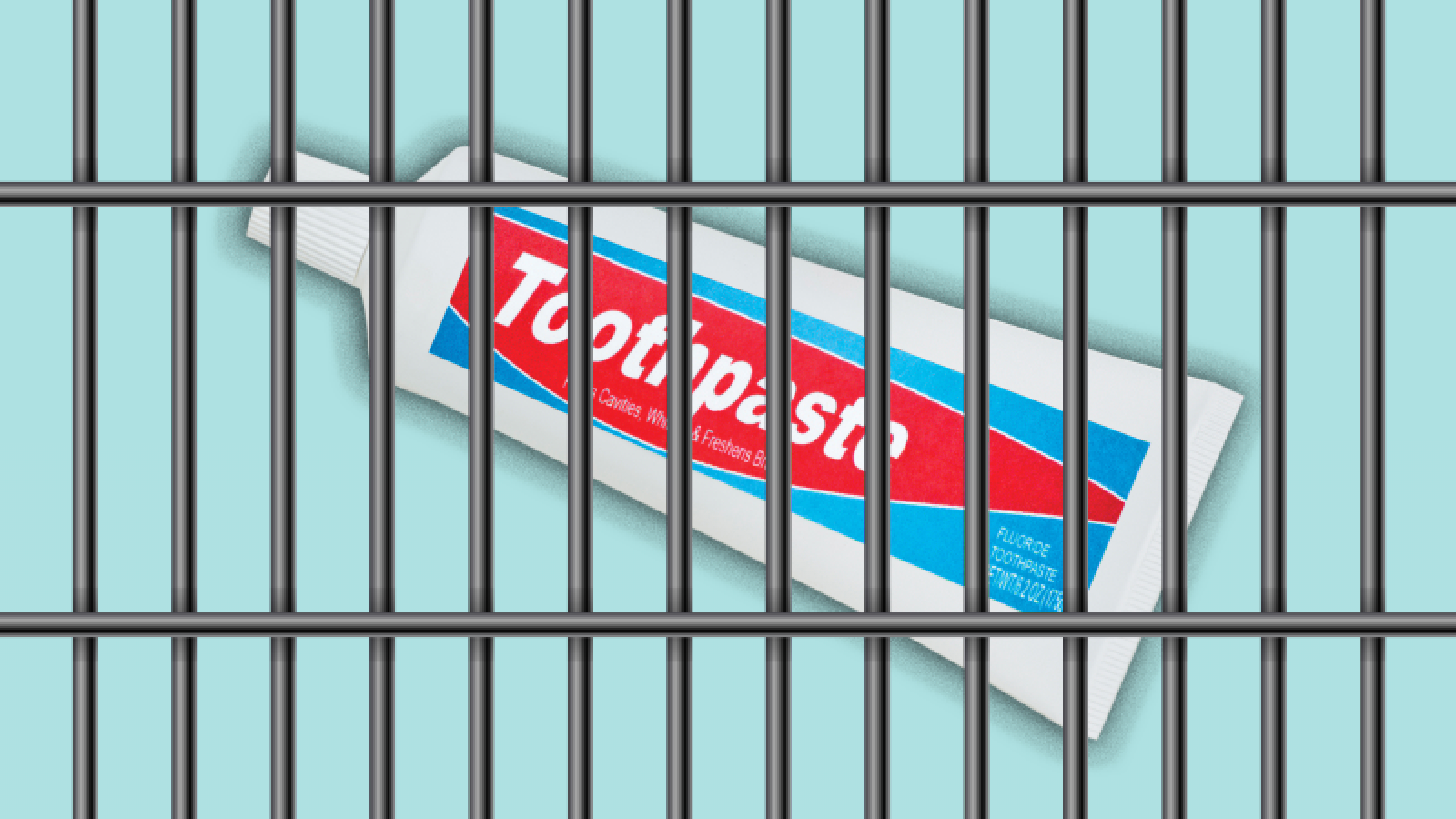 a tube of toothpaste behind metal bars