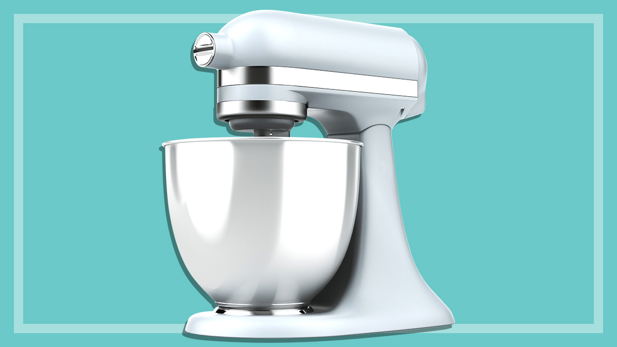 white kitchen mixer on a teal background