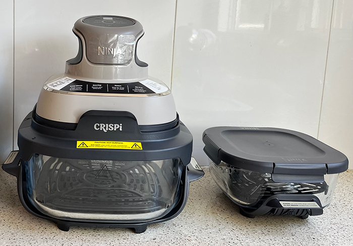 Ninja Crispi sitting on a bench with accessories